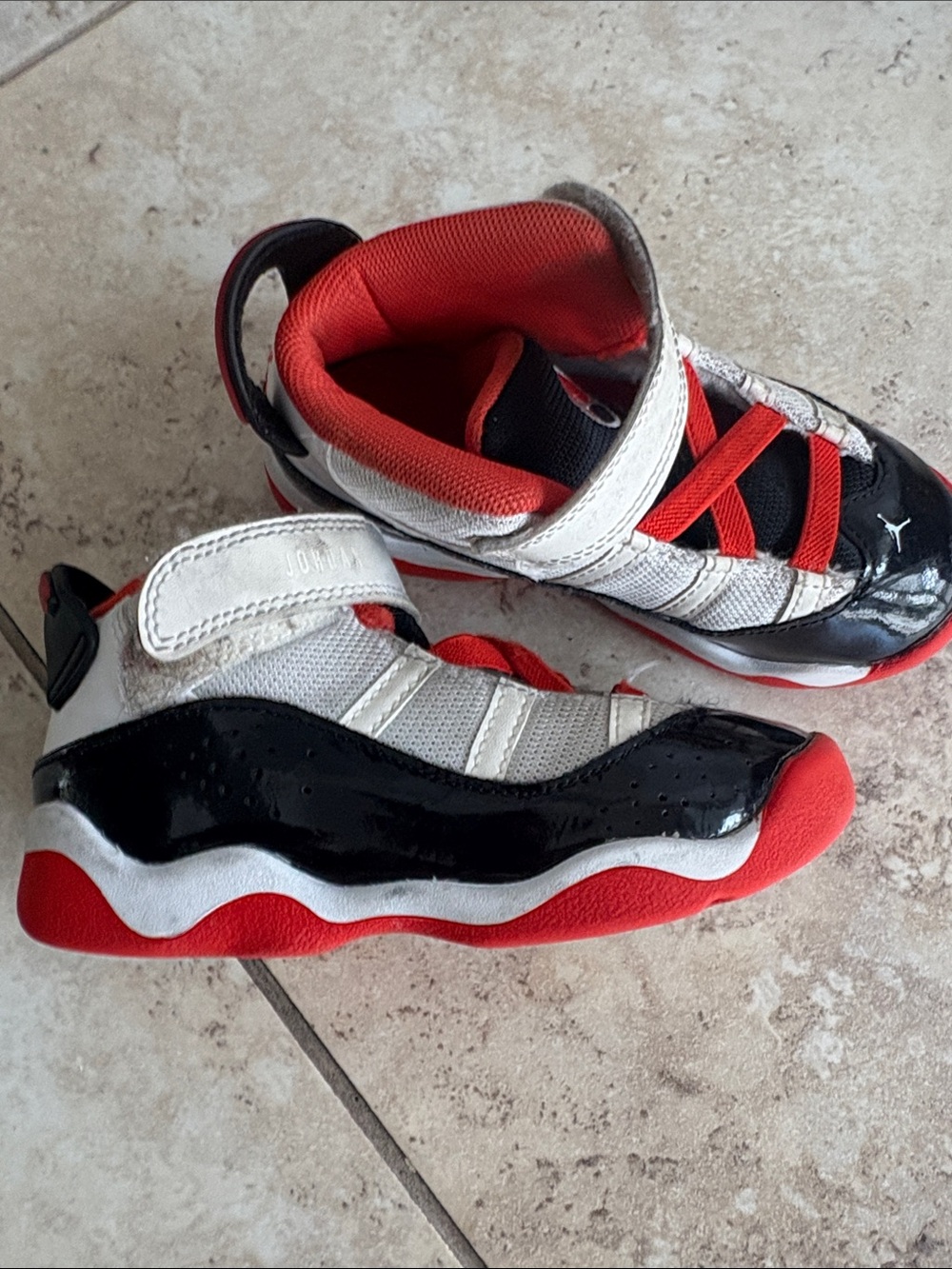 Kids Jordan’s GUC Red, Black & White Athletic Shoes
